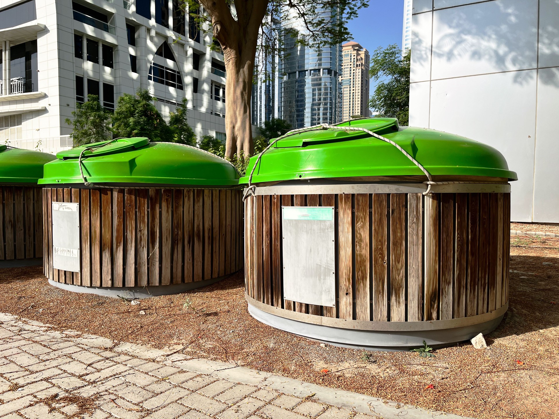 Row of modern eco-friendly waste bins. Waste management systems designed for recycling and environmental sustainability.